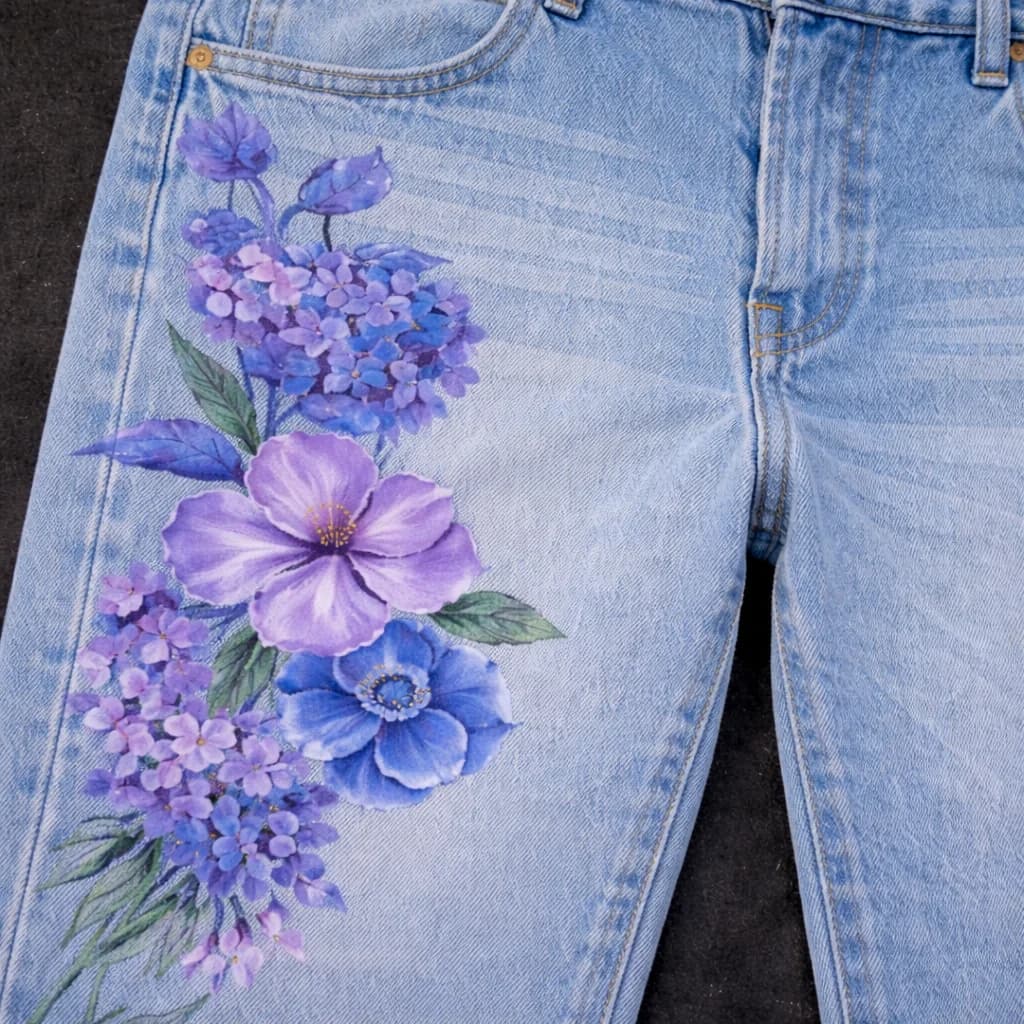 Purple and blue floral arrangement on light wash denim